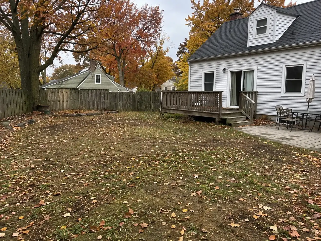 Patchy residential backyard lawn before artificial turf installation in the Tri-State area